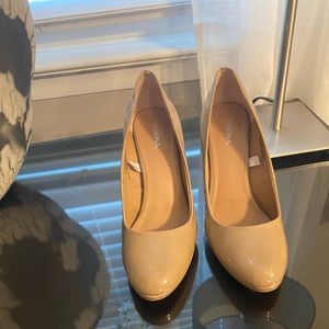 Beige high heel shoes